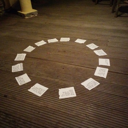 Circle of cards on the ground